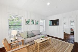 a living room with a couch and a table at Comfy Holiday Loft 8min from Downtown FW in Fort Worth