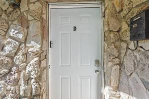 a white door with the letter d on it at Comfy Holiday Loft 8min from Downtown FW in Fort Worth