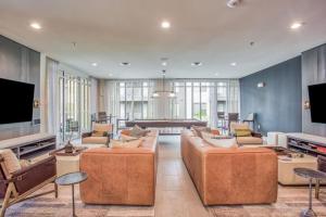 a large living room with two couches and a television at Fascinating 2BD 2BA w Beautiful Pool in Fort Worth in Fort Worth