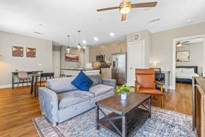 a living room with a couch and a table at Fascinating 2BD 2BA w Beautiful Pool in Fort Worth in Fort Worth