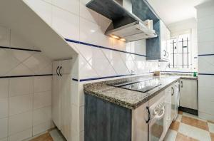 a kitchen with a sink and a counter top at Casa Ana in Punta Umbría