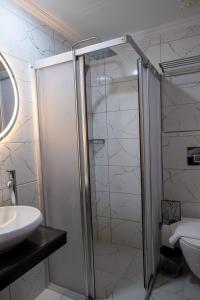 a bathroom with a shower and a sink at Trend Hotel in Nazilli +13 photos
