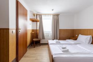 Letto o letti in una camera di Robert Hotel