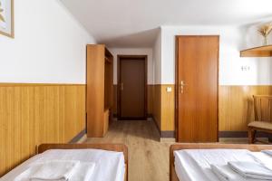 Letto o letti in una camera di Robert Hotel