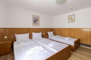Letto o letti in una camera di Robert Hotel
