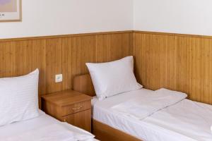 Letto o letti in una camera di Robert Hotel