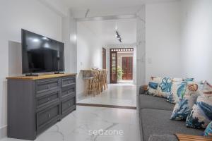 Μια τηλεόραση ή/και κέντρο ψυχαγωγίας στο PSN - Apartamentos proximos da praia de cabeçudas