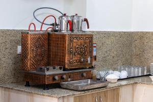 a kitchen counter with a coffee maker on top at Trend Hotel in Nazilli