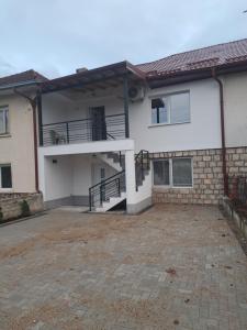an empty parking lot in front of a house at Sky Center Apartments in Ohrid