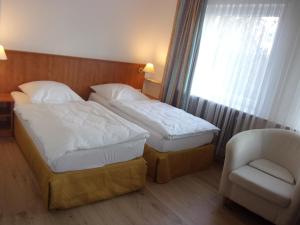 Postel nebo postele na pokoji v ubytování Hotel Fährhaus