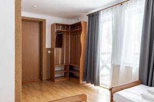 Letto o letti in una camera di Robert Hotel