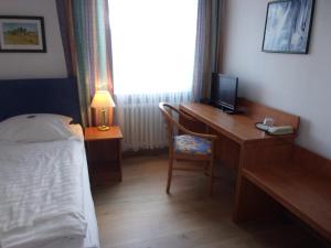 Postel nebo postele na pokoji v ubytování Hotel Fährhaus