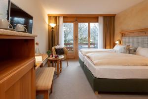 Postel nebo postele na pokoji v ubytování SALZANO Hotel - Spa - Restaurant + 37 fotografií