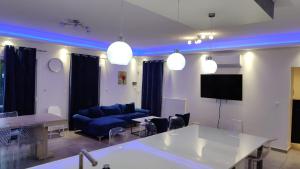 a living room with a couch and a table at Villa T5 proche centre ville in Aix-les-Bains