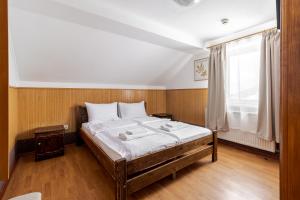 Letto o letti in una camera di Robert Hotel