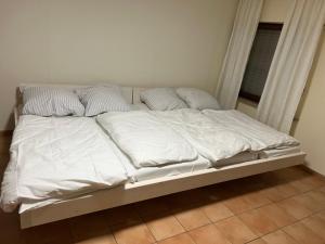 Postel nebo postele na pokoji v ubytování HS Hotel
