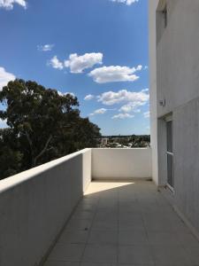 a view from a balcony of a white building at Apartamento Paris con 2 habitaciones in San Luis