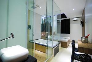 Ένα μπάνιο στο Hotel Classe A LTDA