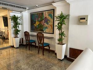 Posezení v ubytování TAMA Hotel Granada Real Cali