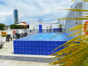 Bazén v ubytování TAMA Hotel Granada Real Cali nebo v jeho okolí