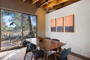 a dining room with a table and chairs at Casa de Flechas in Santa Fe NM in Santa Fe