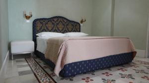 A bed or beds in a room at Baglio Sant’Angelo