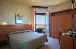 Postel nebo postele na pokoji v ubytování Hotel Cristina + 33 fotografií