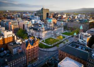 an aerial view of a city at sunset at The Annadale - Luxury 3 bd House - Gold Short Term Stays in Belfast
