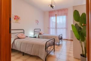 Postel nebo postele na pokoji v ubytování Rivoli FC suite