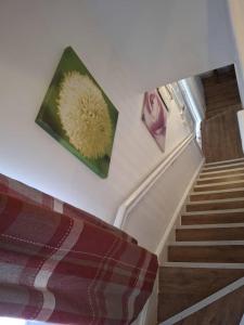 a room with a picture of a flower on the wall at Kilvington Crib in Sheffield