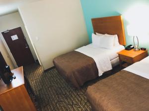 Postel nebo postele na pokoji v ubytování Aspen Hotel