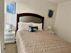 a bedroom with a large bed with two night stands at In The Heart Of Las Vegas Yet Away From The Noise in Las Vegas