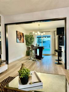 a living room with a table and a dining room at In The Heart Of Las Vegas Yet Away From The Noise in Las Vegas