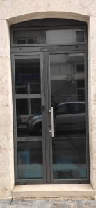 a sliding glass door in a building at San Domenico 9 in Bitetto +8 photos