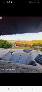 a picture of a building with pillows on the ground at MareBob in Peršaves