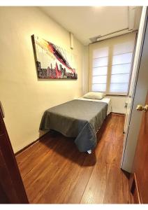 Postel nebo postele na pokoji v ubytování Hostel La Moneda