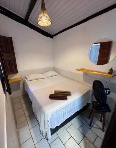 Postel nebo postele na pokoji v ubytování Casa Boa Suites + 25 fotografií