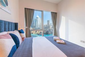 Giường trong phòng chung tại Burj Khalifa & Fountain View NYE Holiday Stay