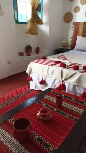 Postel nebo postele na pokoji v ubytování Riad rajad Marrakech