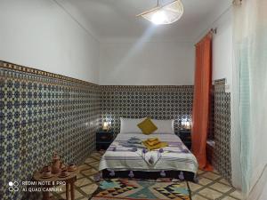 Postel nebo postele na pokoji v ubytování Riad rajad Marrakech