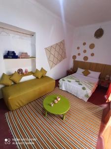 Postel nebo postele na pokoji v ubytování Riad rajad Marrakech