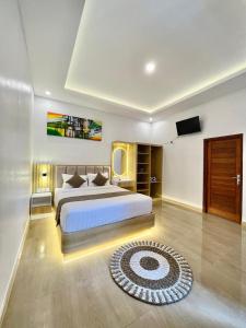 Giường trong phòng chung tại Harmonia batur villa