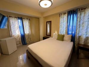 En eller flere senger på et rom på Hotel Turístico Marian