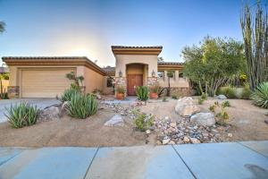 a house with a driveway and a garage at Spacious Palm Desert Home with Patio, Pool and Grill in Palm Desert