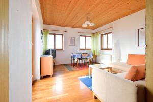 a living room with a couch and a table at Apartments Rosemary in Lucija