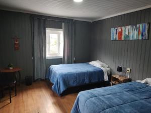 Postel nebo postele na pokoji v ubytování Hostal La Casona Ensenada con parking + 29 fotografií