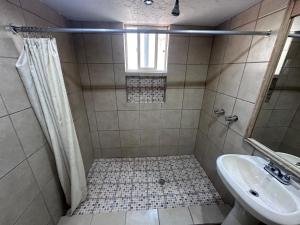 a bathroom with a shower and a sink at Condominio 1 in San Felipe
