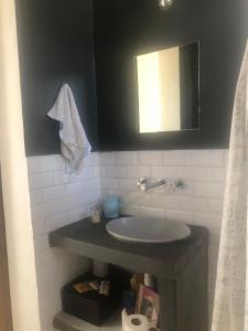 a bathroom with a sink and a mirror at A Morriña in Santa Lucía +48 photos