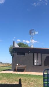 a building with a windmill on top of it at A Morriña in Santa Lucía