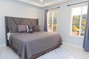 Postelja oz. postelje v sobi nastanitve Caldera Villas